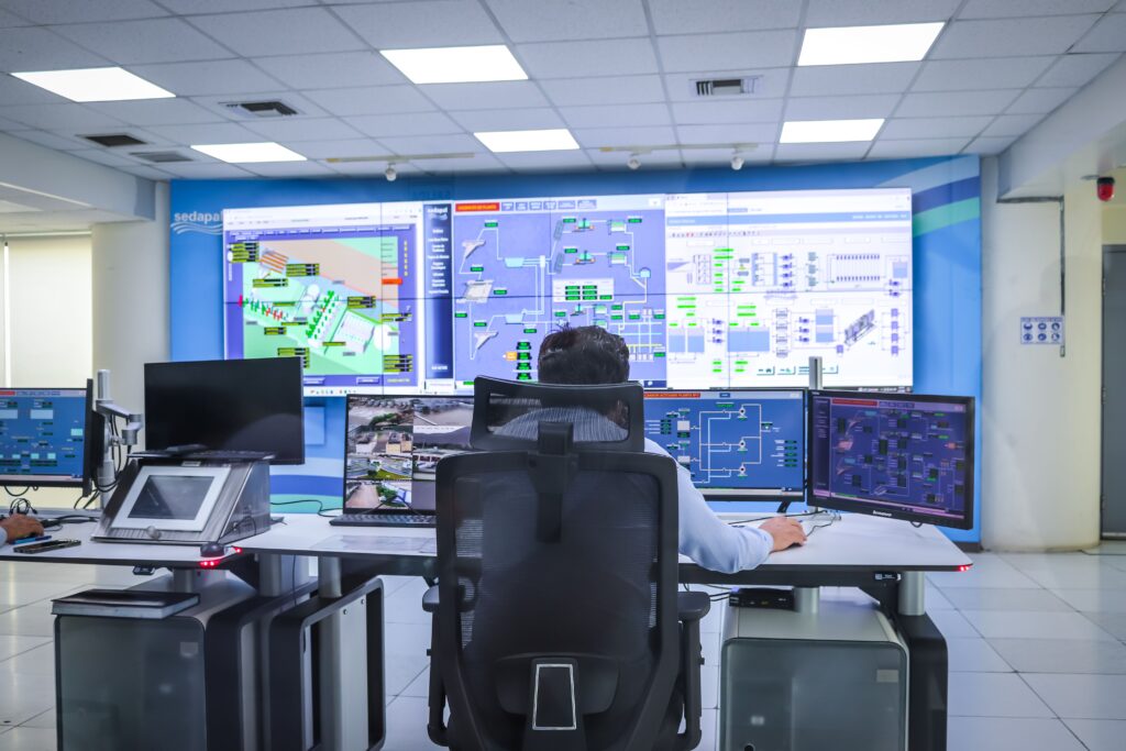 pexels photo 32529341 32529341 Operator in a modern control room managing technological systems in El Agustino, Lima.